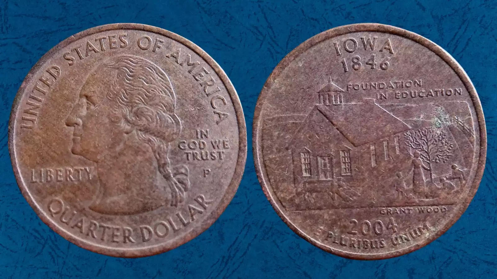 2004 State Quarter missing clad layer error — copper-orange color on one side due to failed nickel bonding